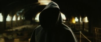Movie still from “Crimson Rivers 2: Angels of the Apocalypse” (2004), directed by Olivier Dahan – A person in a hooded sweatshirt in the dark; Close Up shot, Low angle