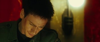 Movie still from “Crimson Rivers 2: Angels of the Apocalypse” (2004), directed by Olivier Dahan – A person wearing a green uniform; Close Up shot, Low angle