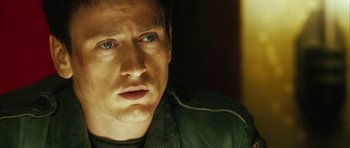 Movie still from “Crimson Rivers 2: Angels of the Apocalypse” (2004), directed by Olivier Dahan – A person wearing a black jacket; Close Up shot, Over the shoulder angle