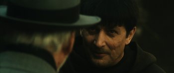Movie still from “Crimson Rivers 2: Angels of the Apocalypse” (2004), directed by Olivier Dahan – A man in a hat looking at another man in a hat; Close Up shot, Over the shoulder angle