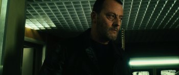 Movie still from “Crimson Rivers 2: Angels of the Apocalypse” (2004), directed by Olivier Dahan – A person wearing a black jacket; Close Up shot, Low angle