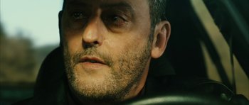 Movie still from “Crimson Rivers 2: Angels of the Apocalypse” (2004), directed by Olivier Dahan – A man's face with a beard; Close Up shot, Low angle
