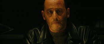 Movie still from “Crimson Rivers 2: Angels of the Apocalypse” (2004), directed by Olivier Dahan – A person wearing a leather jacket; Close Up shot, Over the shoulder angle