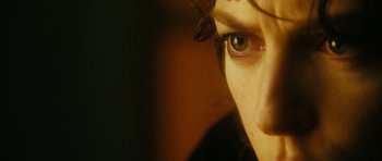 Movie still from “Crimson Rivers 2: Angels of the Apocalypse” (2004), directed by Olivier Dahan – A person's eye with a butterfly on it's head; Extreme Close Up shot, Over the shoulder angle