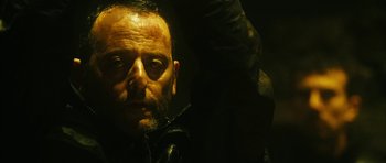 Movie still from “Crimson Rivers 2: Angels of the Apocalypse” (2004), directed by Olivier Dahan – A person wearing a black jacket; Close Up shot, Low angle