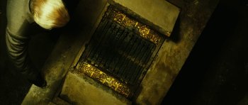 Movie still from “Crimson Rivers 2: Angels of the Apocalypse” (2004), directed by Olivier Dahan – An old jail cell with a metal gate; Extreme Close Up shot, Overhead angle