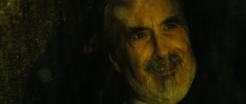 Movie still from “Crimson Rivers 2: Angels of the Apocalypse” (2004), directed by Olivier Dahan – An older man with a beard and mustache; Close Up shot, Over the shoulder angle