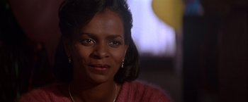 Movie still from “Crimson Tide” (1995), directed by Tony Scott – A person wearing a pink sweater; Close Up shot, Low angle