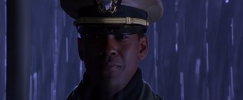 Movie still from “Crimson Tide” (1995), directed by Tony Scott – A person wearing a hat; Close Up shot, Low angle