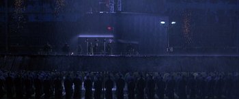 Movie still from “Crimson Tide” (1995), directed by Tony Scott – A group of people standing on top of a platform; Extreme Wide shot, High angle