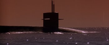 Movie still from “Crimson Tide” (1995), directed by Tony Scott – A submarine in the middle of a body of water; Extreme Wide shot, Low angle