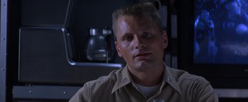 Movie still from “Crimson Tide” (1995), directed by Tony Scott – A person wearing a uniform; Close Up shot, Low angle