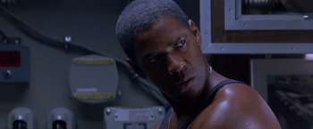 Movie still from “Crimson Tide” (1995), directed by Tony Scott – A person wearing a tank top; Close Up shot, Over the shoulder angle