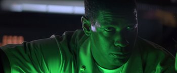 Movie still from “Crimson Tide” (1995), directed by Tony Scott – A man's face in green light; Close Up shot, Low angle