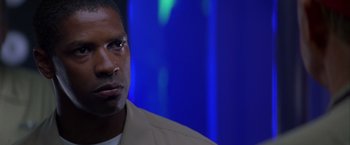 Movie still from “Crimson Tide” (1995), directed by Tony Scott – A person wearing a jacket; Close Up shot, Over the shoulder angle