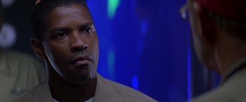 Movie still from “Crimson Tide” (1995), directed by Tony Scott – A person wearing a jacket; Close Up shot, Low angle