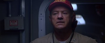 Movie still from “Crimson Tide” (1995), directed by Tony Scott – A person wearing a hat; Close Up shot, Low angle