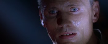 Movie still from “Crimson Tide” (1995), directed by Tony Scott – A man's face with water on his face; Extreme Close Up shot, Low angle