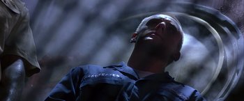 Movie still from “Crimson Tide” (1995), directed by Tony Scott – A person wearing a uniform; Close Up shot, Low angle