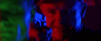 Movie still from “Crimson Tide” (1995), directed by Tony Scott – A person wearing a hat; Close Up shot, Low angle