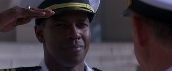 Movie still from “Crimson Tide” (1995), directed by Tony Scott – A person wearing a hat; Close Up shot, Low angle