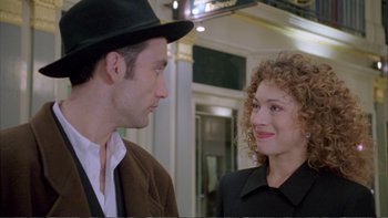 Movie still from “Croupier” (1998), directed by Mike Hodges – A man and a woman talking to each other; Close Up shot, Over the shoulder angle