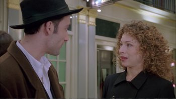 Movie still from “Croupier” (1998), directed by Mike Hodges – A man and a woman talking to each other; Close Up shot, Over the shoulder angle