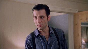 Movie still from “Croupier” (1998), directed by Mike Hodges – A person wearing suspenders; Close Up shot, Low angle