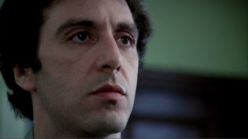 Movie still from “Cruising” (1980), directed by William Friedkin – A man's face looking into the distance; Close Up shot, Low angle