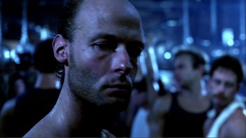 Movie still from “Cruising” (1980), directed by William Friedkin – A person with a beard; Close Up shot, Low angle