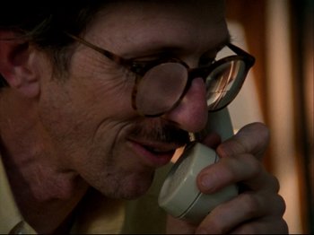 Movie still from “Crumb” (1994), directed by Terry Zwigoff – A person talking on a phone; Close Up shot, Low angle