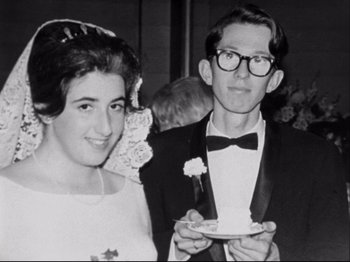 Movie still from “Crumb” (1994), directed by Terry Zwigoff – A man and a woman standing next to each other; Close Up shot, Overhead angle