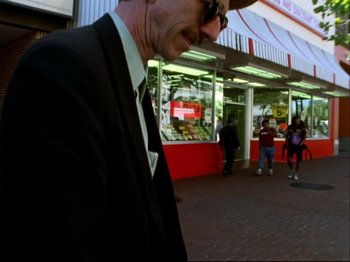 A person wearing a suit and tie
