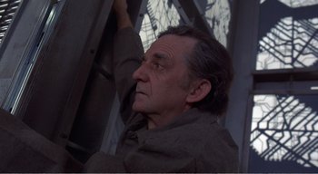 Movie still from “Cube” (1997), directed by Vincenzo Natali – An older man is looking up at the sky; Close Up shot, Low angle
