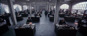 Movie still from “The Greatest Showman” (2017), directed by Michael Gracey – A room filled with people sitting at desks; Wide shot, High angle