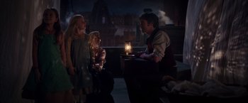 Movie still from “The Greatest Showman” (2017), directed by Michael Gracey – A man and two little girls standing next to each other; Medium shot, Over the shoulder angle