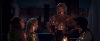 Movie still from “The Greatest Showman” (2017), directed by Michael Gracey – A woman standing next to a girl holding a lit candle; Medium shot, Over the shoulder angle