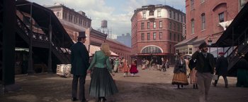 Movie still from “The Greatest Showman” (2017), directed by Michael Gracey – A group of people walking on a street; Extreme Wide shot, High angle
