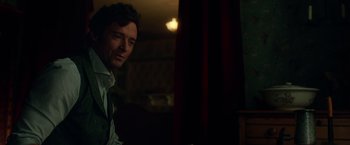 Movie still from “The Greatest Showman” (2017), directed by Michael Gracey – A person sitting in a room; Close Up shot, Over the shoulder angle