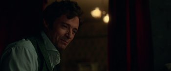 Movie still from “The Greatest Showman” (2017), directed by Michael Gracey – A person wearing a dress shirt; Close Up shot, Over the shoulder angle