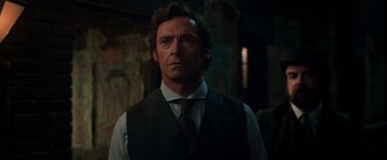 Movie still from “The Greatest Showman” (2017), directed by Michael Gracey – A person wearing a vest and tie; Close Up shot, Low angle