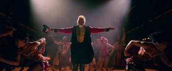 Movie still from “The Greatest Showman” (2017), directed by Michael Gracey – A group of people are performing on a stage; Wide shot, Low angle