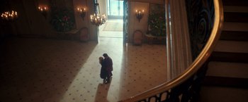 Movie still from “The Greatest Showman” (2017), directed by Michael Gracey – A man and a woman are kissing in a lobby; Extreme Wide shot, High angle
