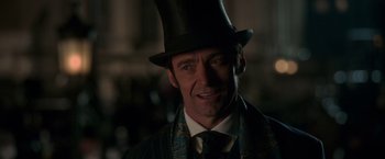 Movie still from “The Greatest Showman” (2017), directed by Michael Gracey – A person wearing a top hat; Close Up shot, Over the shoulder angle
