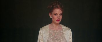 Movie still from “The Greatest Showman” (2017), directed by Michael Gracey – A woman with red hair wearing a white dress; Close Up shot, Low angle