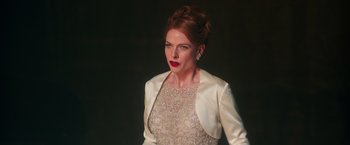 Movie still from “The Greatest Showman” (2017), directed by Michael Gracey – A woman with red hair wearing a white dress; Medium shot, Low angle