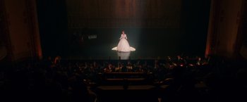 Movie still from “The Greatest Showman” (2017), directed by Michael Gracey – A woman in a white dress on a stage; Extreme Wide shot, High angle