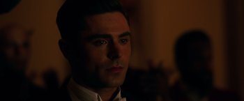 Movie still from “The Greatest Showman” (2017), directed by Michael Gracey – A person wearing a suit and tie; Close Up shot, Over the shoulder angle