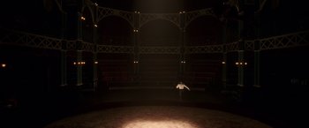 Movie still from “The Greatest Showman” (2017), directed by Michael Gracey – A man standing in the middle of an empty stage; Extreme Wide shot, High angle