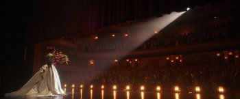 Movie still from “The Greatest Showman” (2017), directed by Michael Gracey – A crowd of people sitting in front of stage lights; Extreme Wide shot, High angle